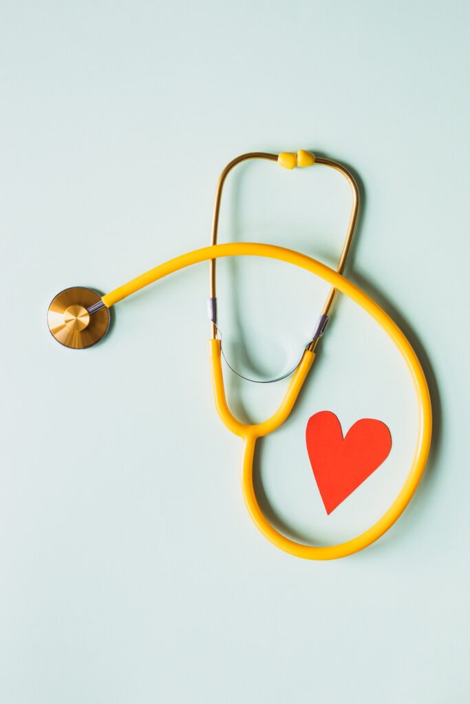 Medical stethoscope with red paper heart