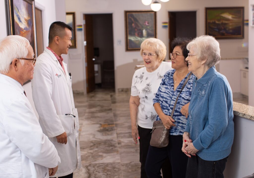 Doctors speaking with patients